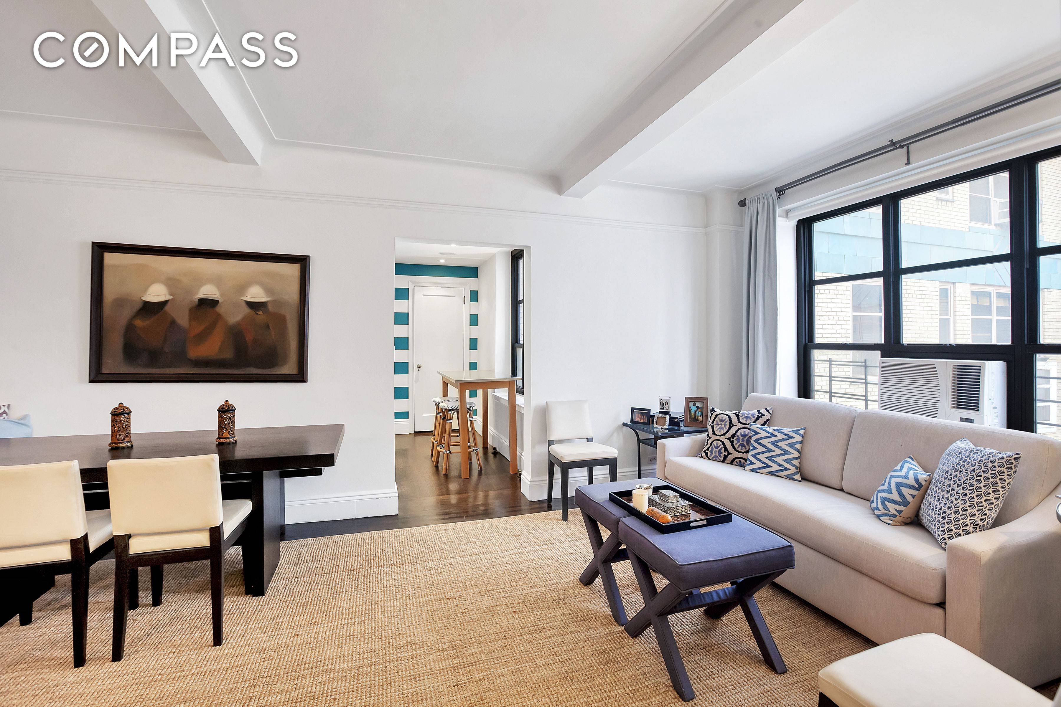 9P is a charming one bedroom apartment with a wood burning fireplace and northern views showcasing some of the city's most iconic buildings, including the Chrysler Building.