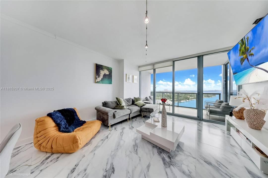 Welcome to BLUE Condo by Arquitectonica, offering unobstructed bay amp ; ocean views through 9 ft floor to ceiling glass.