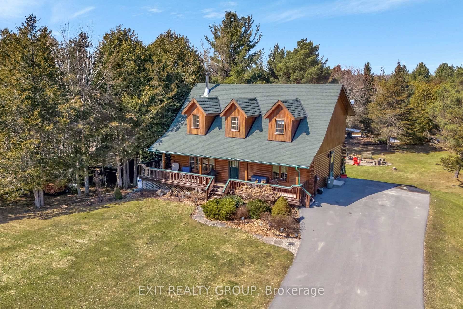 Welcome to this beautiful 4 bedroom, 2 bathroom log home with wrap around deck, where rustic charm meets modern comfort !