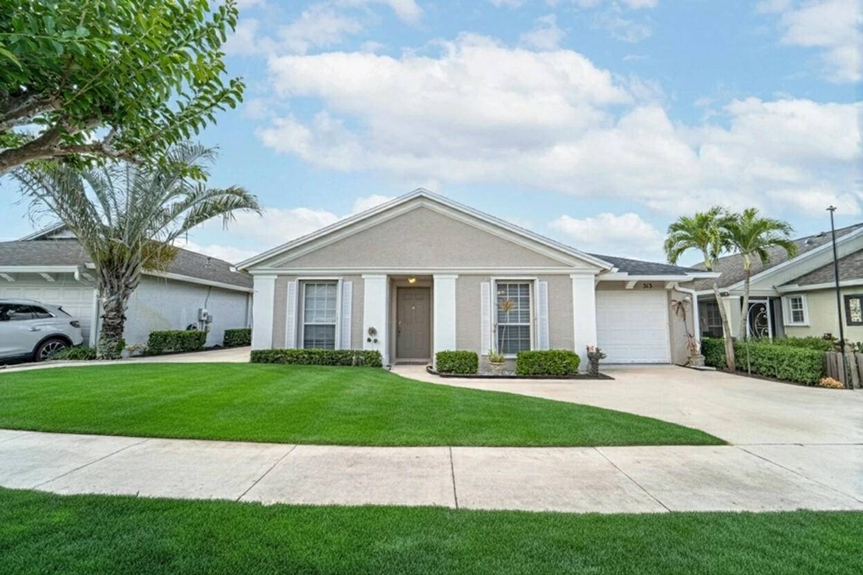 LAKEFRONT LIVING in this beautiful gated community conveniently located in St.