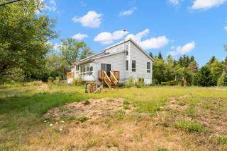 Welcome to a serene retreat at 59 Novotny Court in Consecon, a spacious haven nestled among nature and scenic waters in the heart of Prince Edward County.