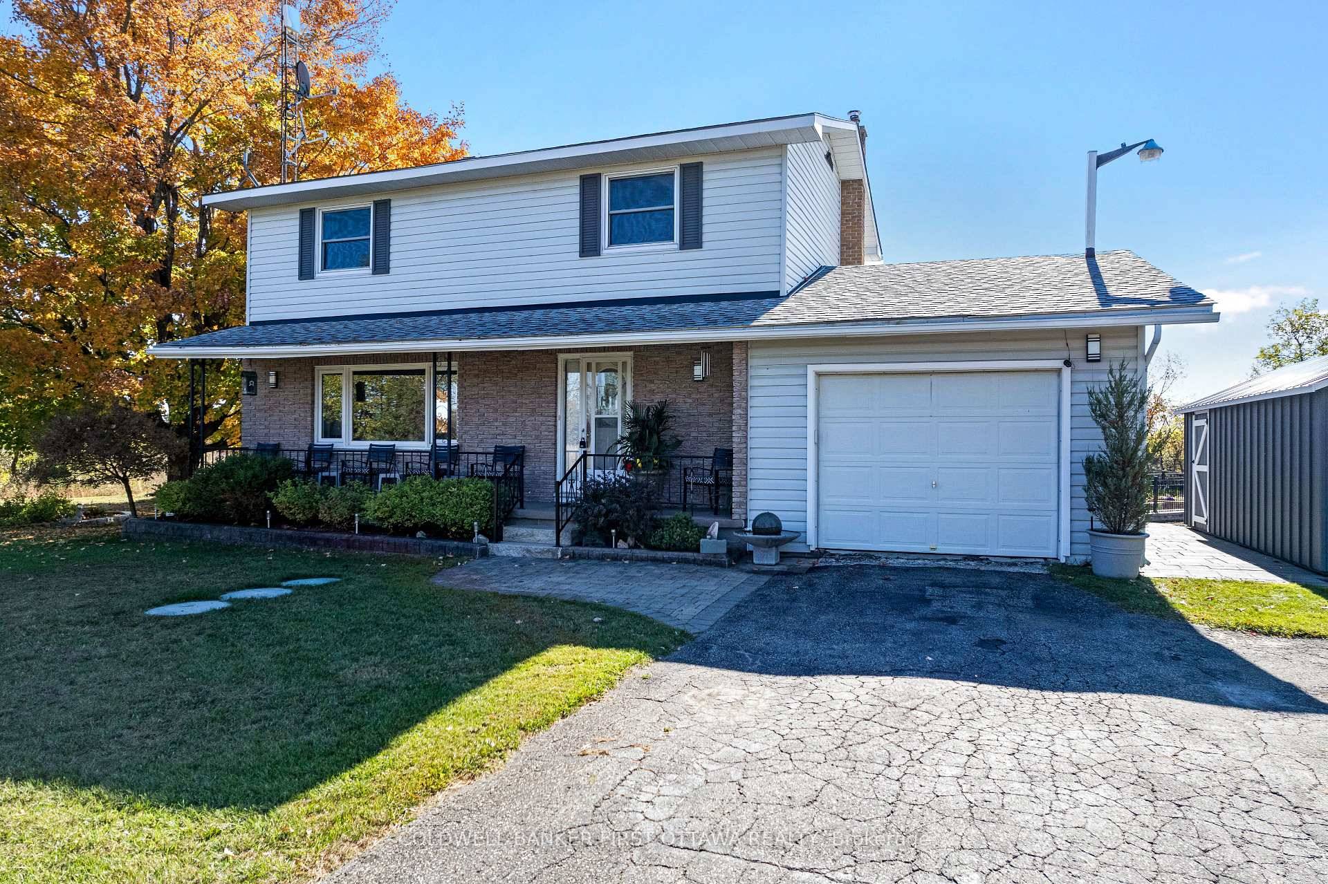 Peaceful country setting for spacious family home on one acre, professionally landscaped by horticulturalists.