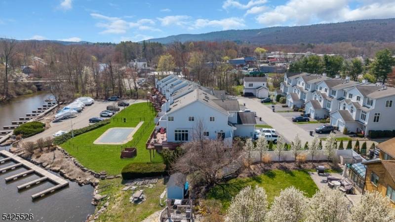 Experience lakefront living at its finest in this exceptional end unit townhome on beautiful Greenwood Lake NJ.
