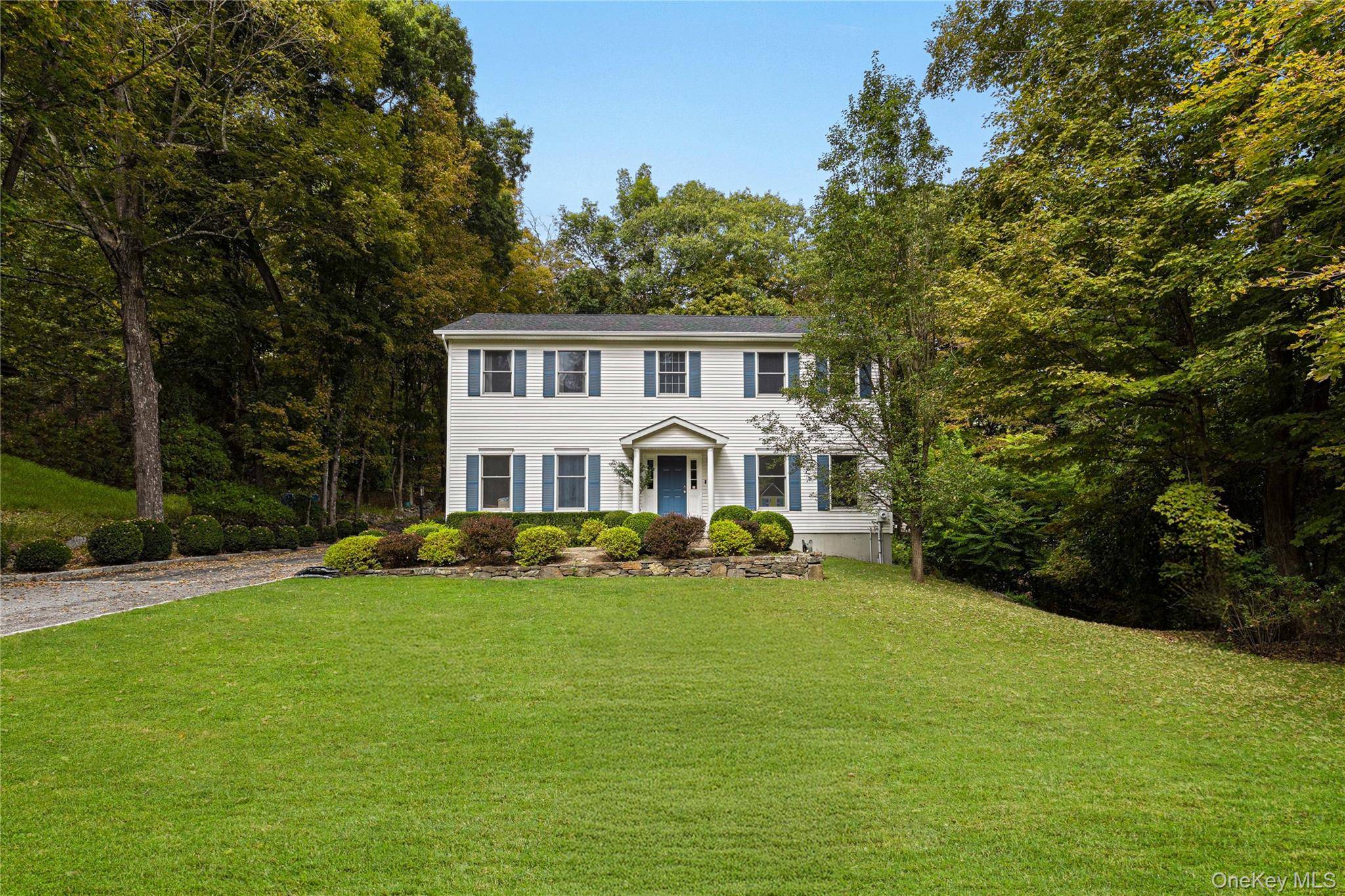 Welcome to this elegant four bedroom, three and one half bath center hall colonial, offering a perfect blend of comfort and functionality.