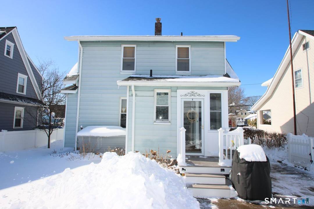 Charming and inviting Colonial home nestled on a beautiful tree lined street.