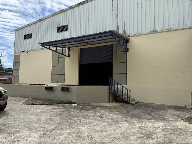 Prime 15, 000 sq ft warehouse featuring 28 foot clear height ceiling, two loading docks plus one rolling door, three phase energy, and direct access to PR 2.