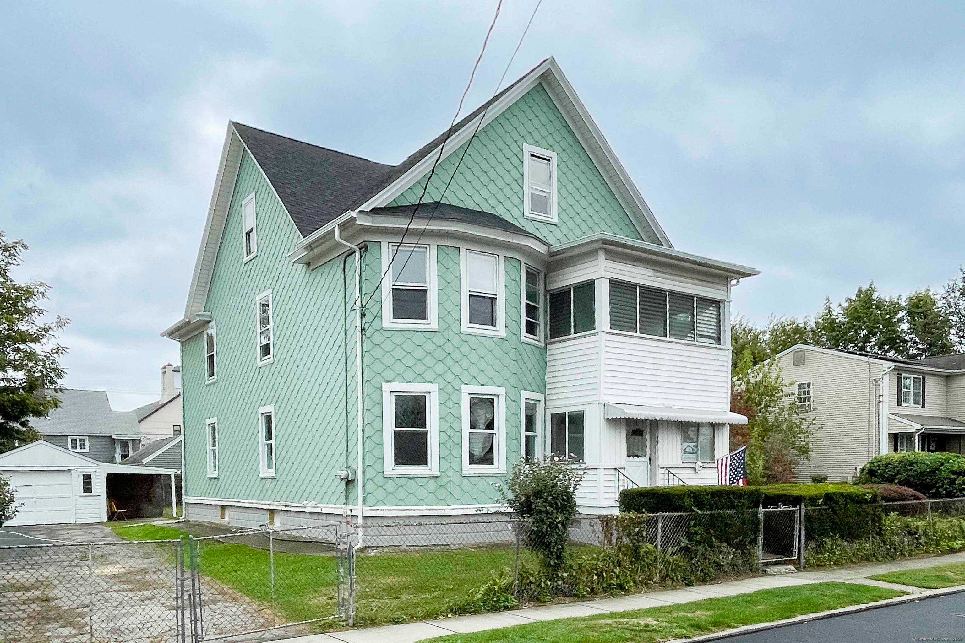 Beautiful well maintained two family with a double sized lot !