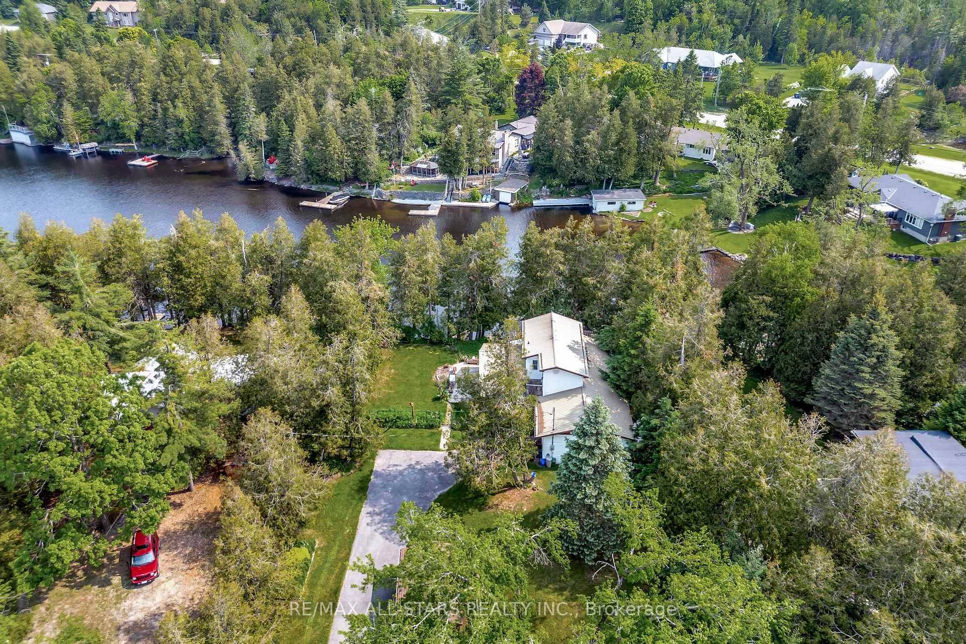 Welcome to this charming two story home nestled along a peaceful canal, with direct access to beautiful Sturgeon Lake.