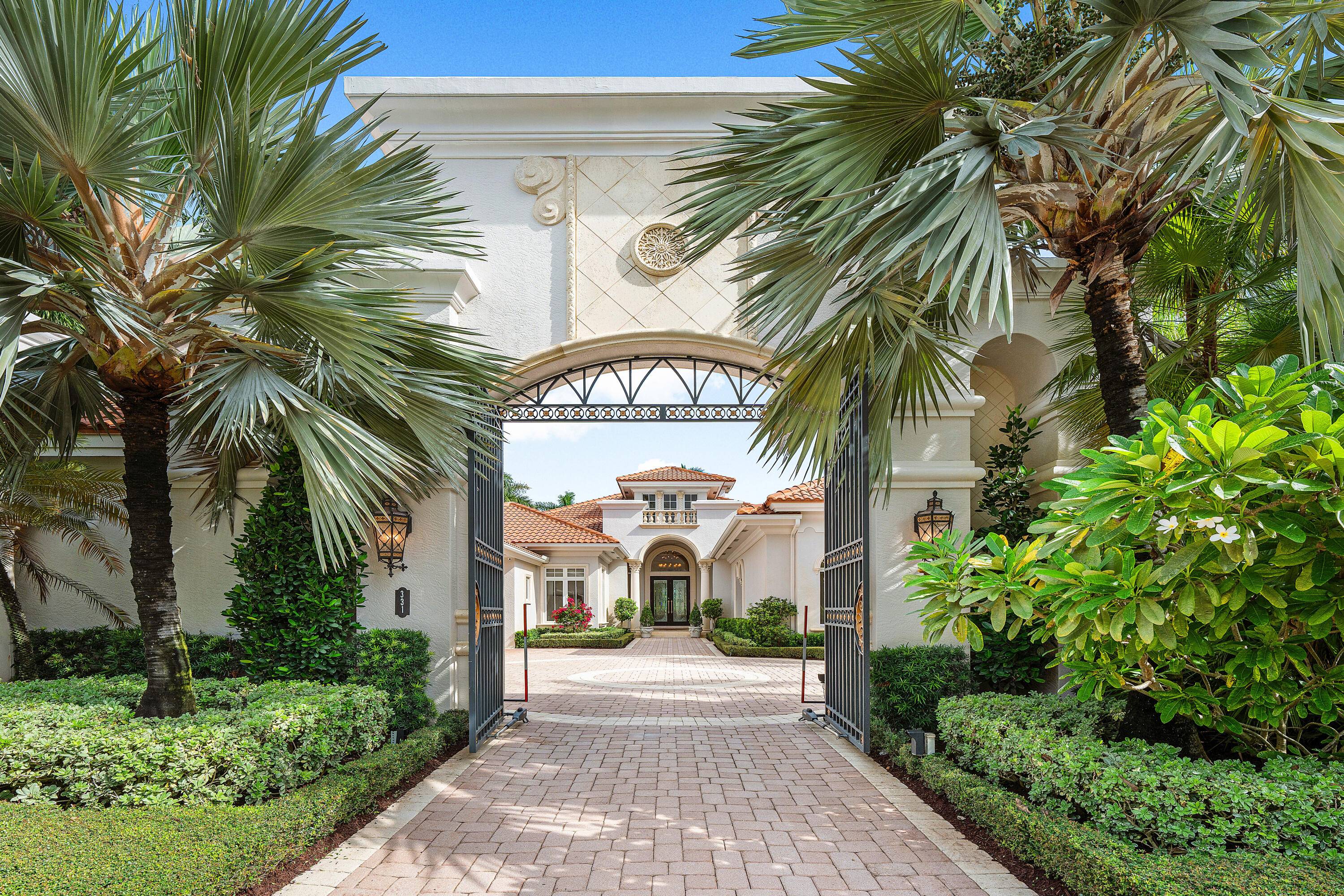 331 Mizner Lake Estates Drive is an exceptional property situated on the grounds of the iconic resort and club The Boca Raton.