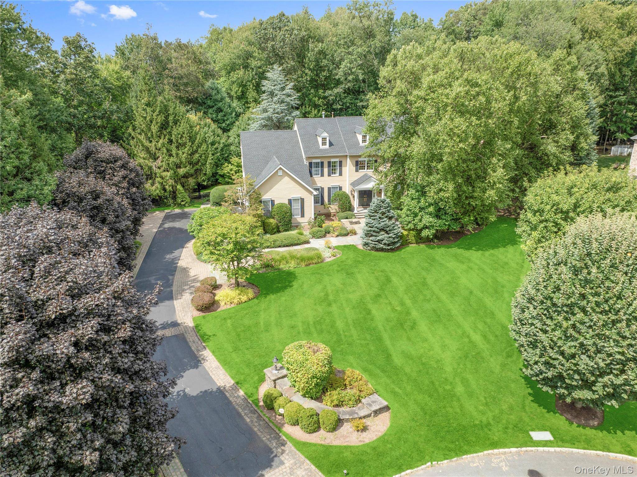 Welcome to this timeless center hall Colonial set on beautifully landscaped grounds in the sought after Leisure Farm community.