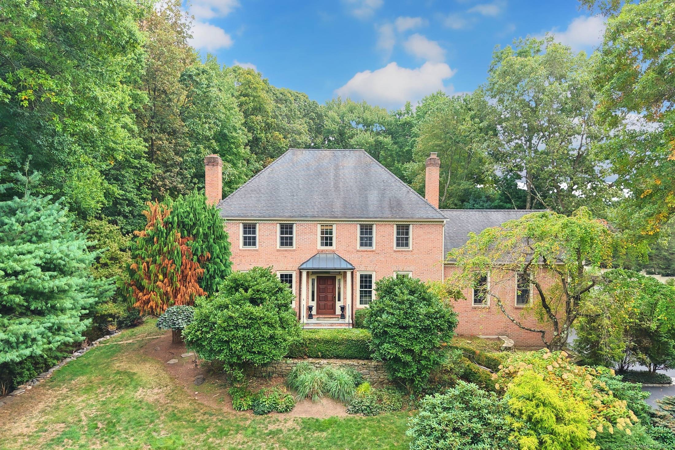 254 Sherwood Farm Road, tucked away at the end of a cul de sac in the desirable lower Greenfield Hill section of Fairfield, this stately brick Colonial blends timeless curb ...