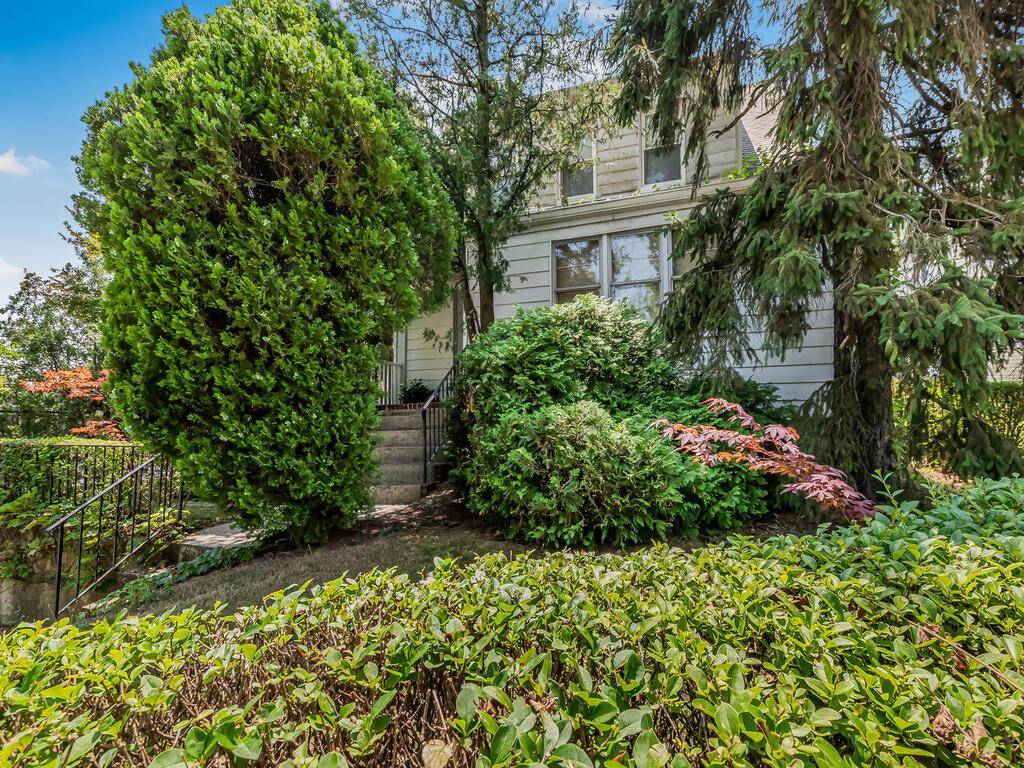 Legal two family home on oversized lot in a most convenient location.