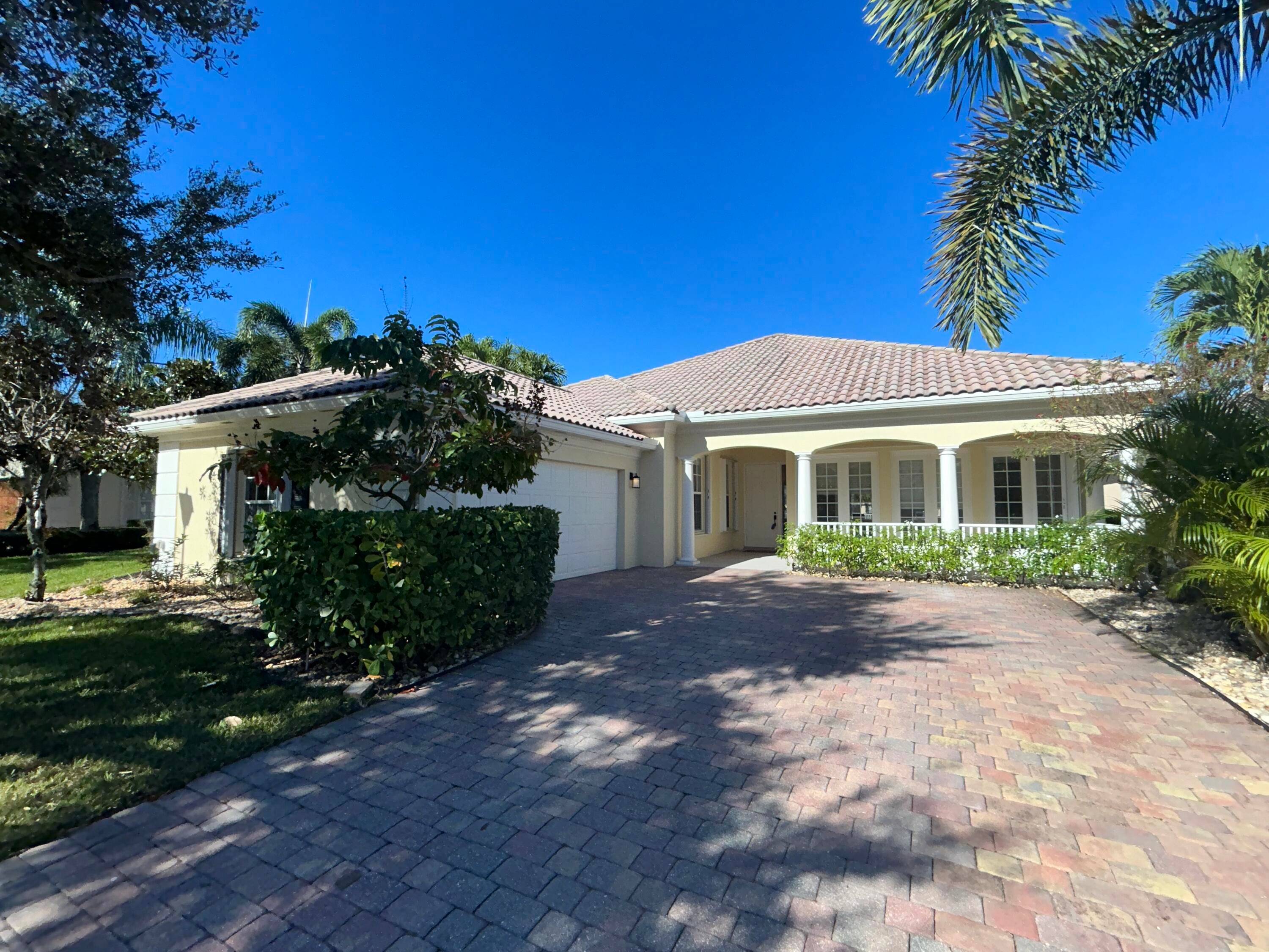 Stunning 4 bedroom 3 full bath waterfront home in the highly desirable Wellington community VillageWalk.