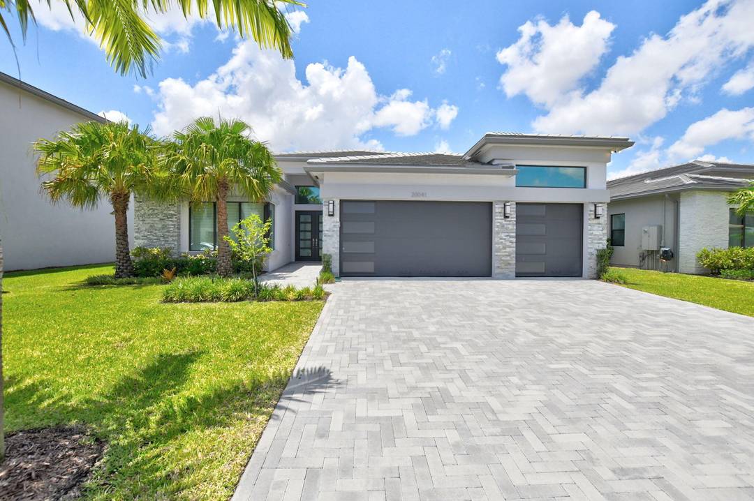 Experience luxury living in this newer, never lived in Premium Santo Grand model in the exclusive Bali Collection at Lotus Palm.