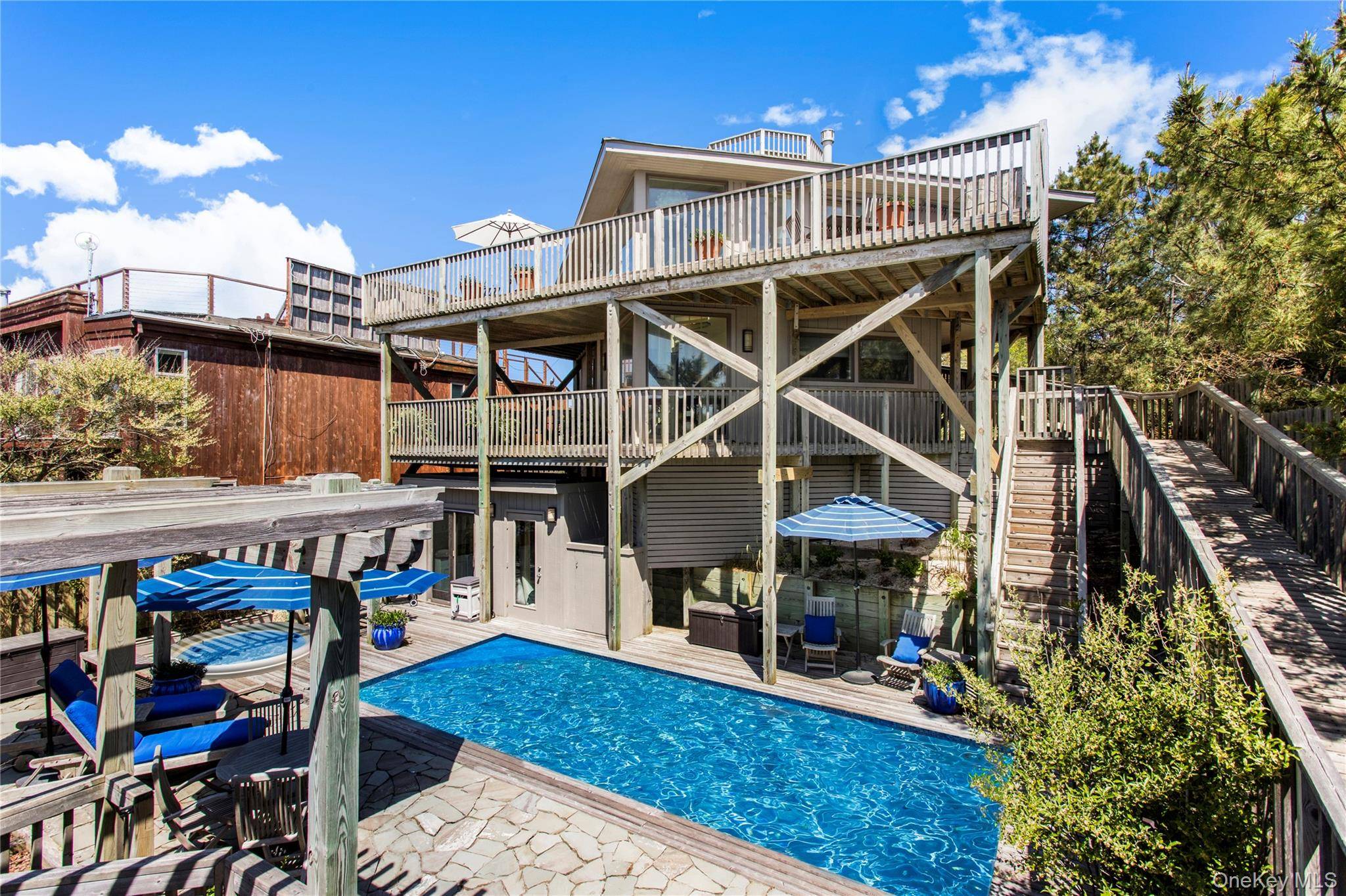 Soaring high above the dune and offering panoramic ocean views in every direction, this iconic octagon houses a classic example of Pines mid century architecture.