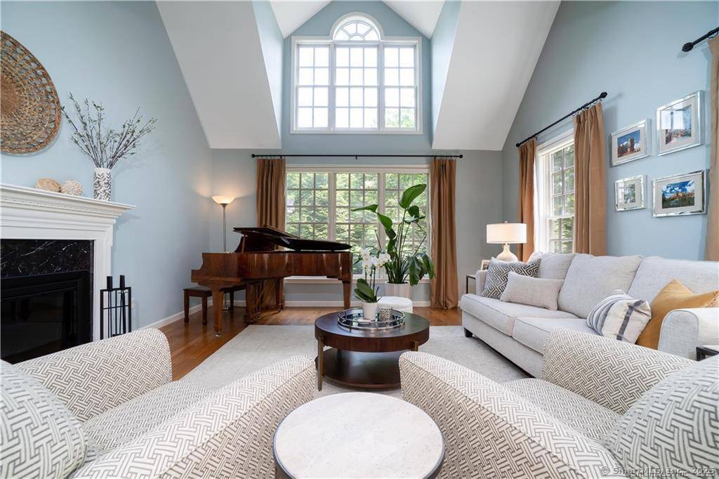 Luxury townhome living in desirable Old Field Village !