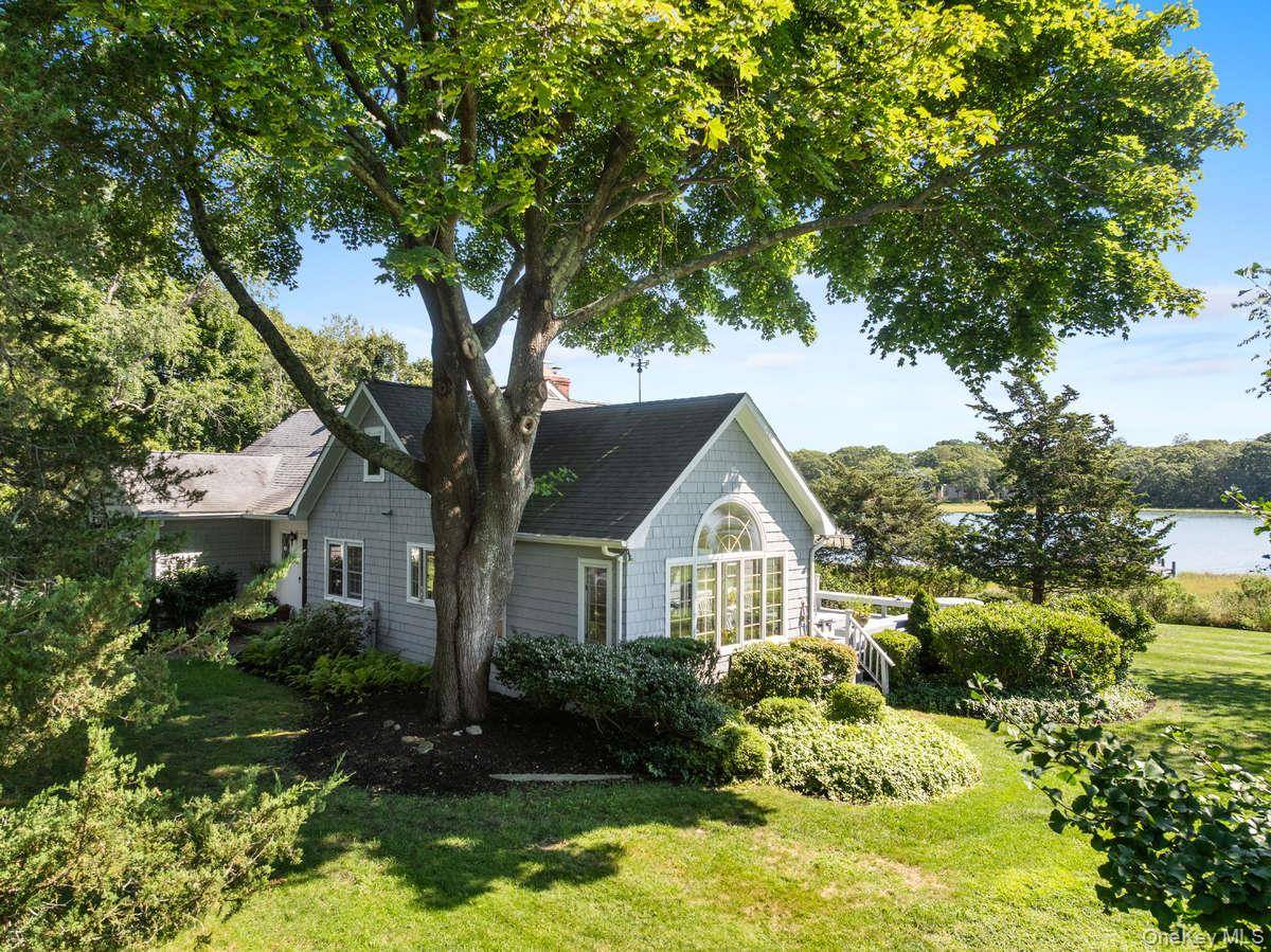 Your North Fork Waterfront Haven Awaits A Rare waterfront 1947 Nantucket cedar shingled expanded home.