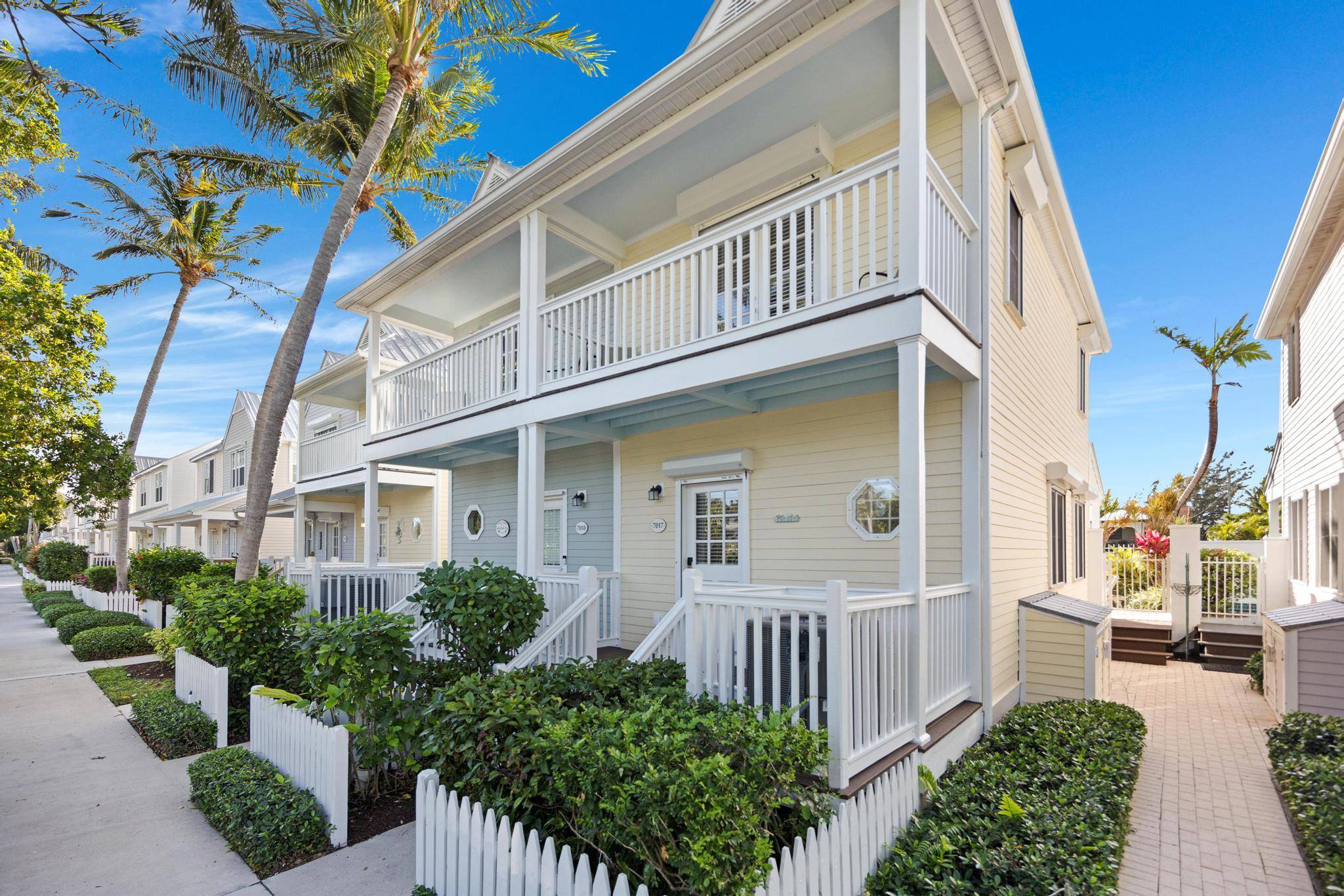 This immaculate two bedroom, two bath canal front townhome offers a delightful blend of Florida Keys charm and modern updates.