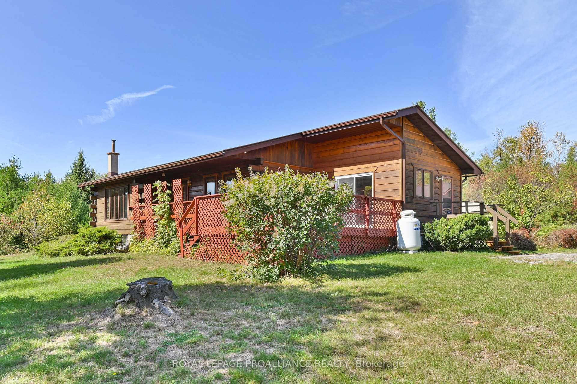 Experience the perfect retreat with this charming 1990's built log home nestled on 92 scenic acres just a short 15 minute drive from Tweed, Northbrook, and Highway 7, and only ...