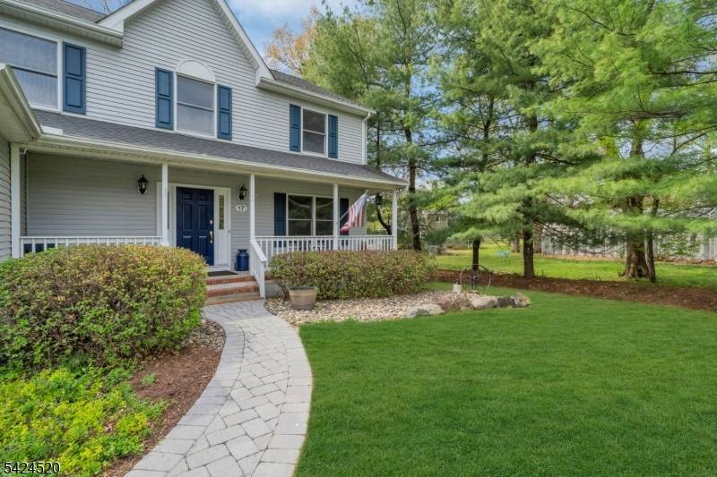 Impressive Colonial offering the perfect blend of space, comfort, and seamless flow, set on a beautifully maintained property along a picturesque, storybook street with charming curb appeal.