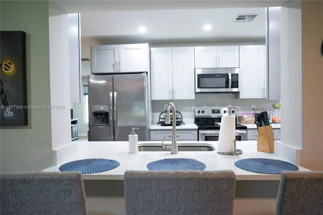 Here is a great opportunity to own a fully remodeled home in The Mainlands of Tamarac.