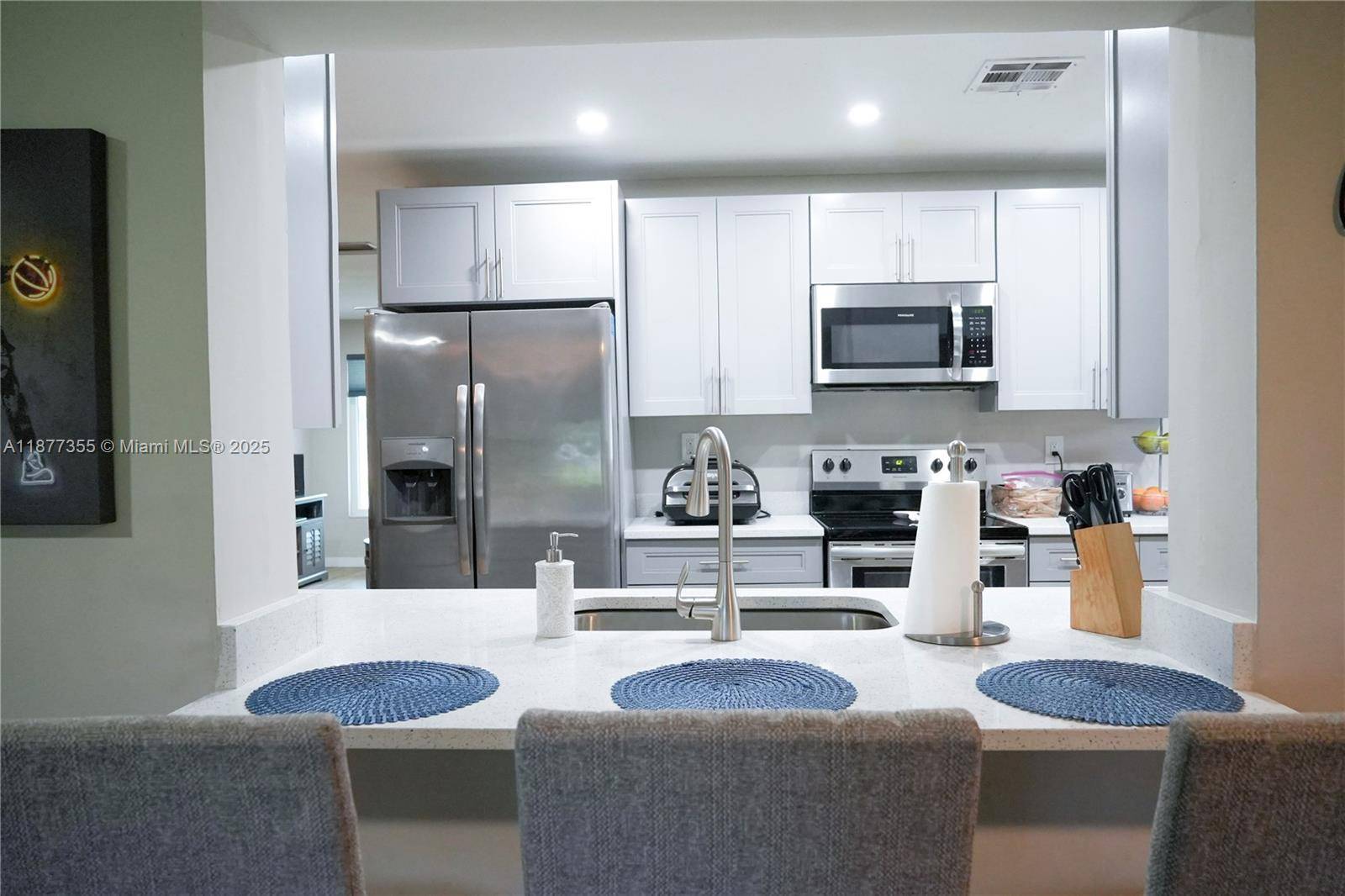 Here is a great opportunity to own a fully remodeled home in The Mainlands of Tamarac.