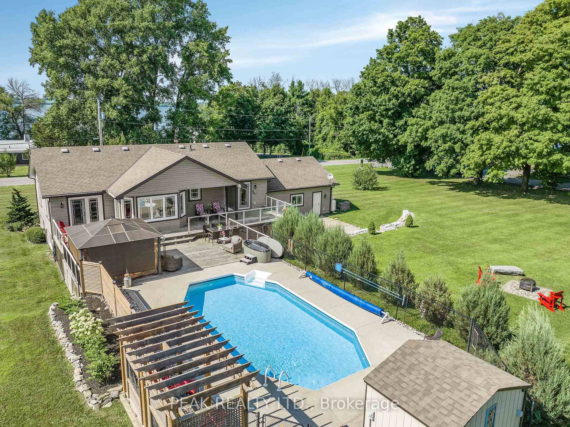 Wake up to breathtaking views of Lake Ontario in this custom built bungalow that blends luxury with everyday comfort.