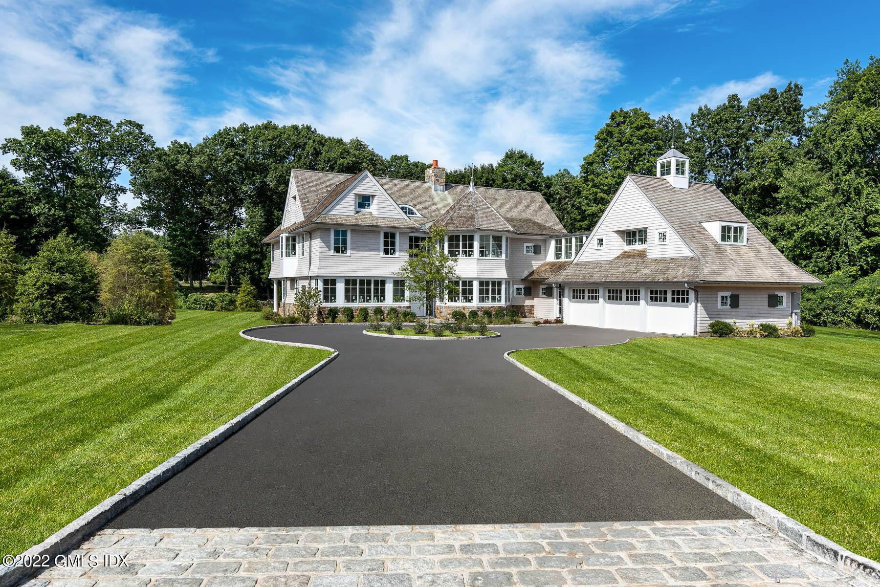 Stunning new construction designed by architect Christopher Pagliaro and built by Premier Home Builders off of the private Stillman Lane.