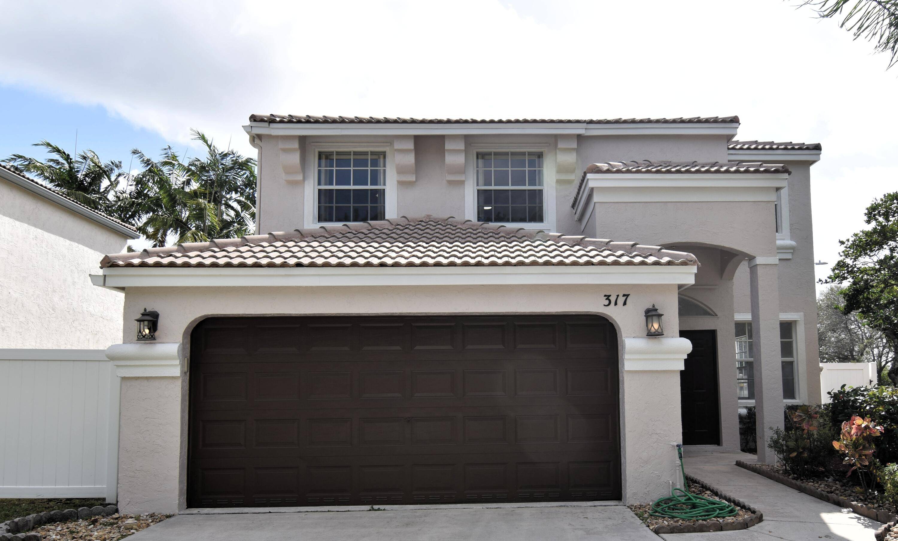 Beautifully Updated Corner Lot Home in Secure Gated CommunityThis rare corner lot family home has been lovingly maintained and freshly redecorated inside and out truly move in ready.