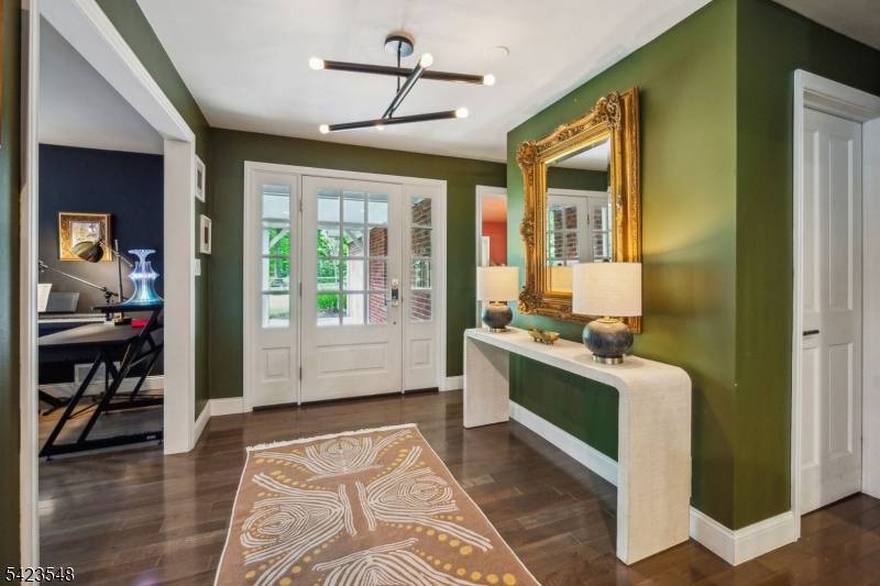 This luxury rental in Summit's desirable Franklin School District sits on over 2 acres of lush, private landscape.