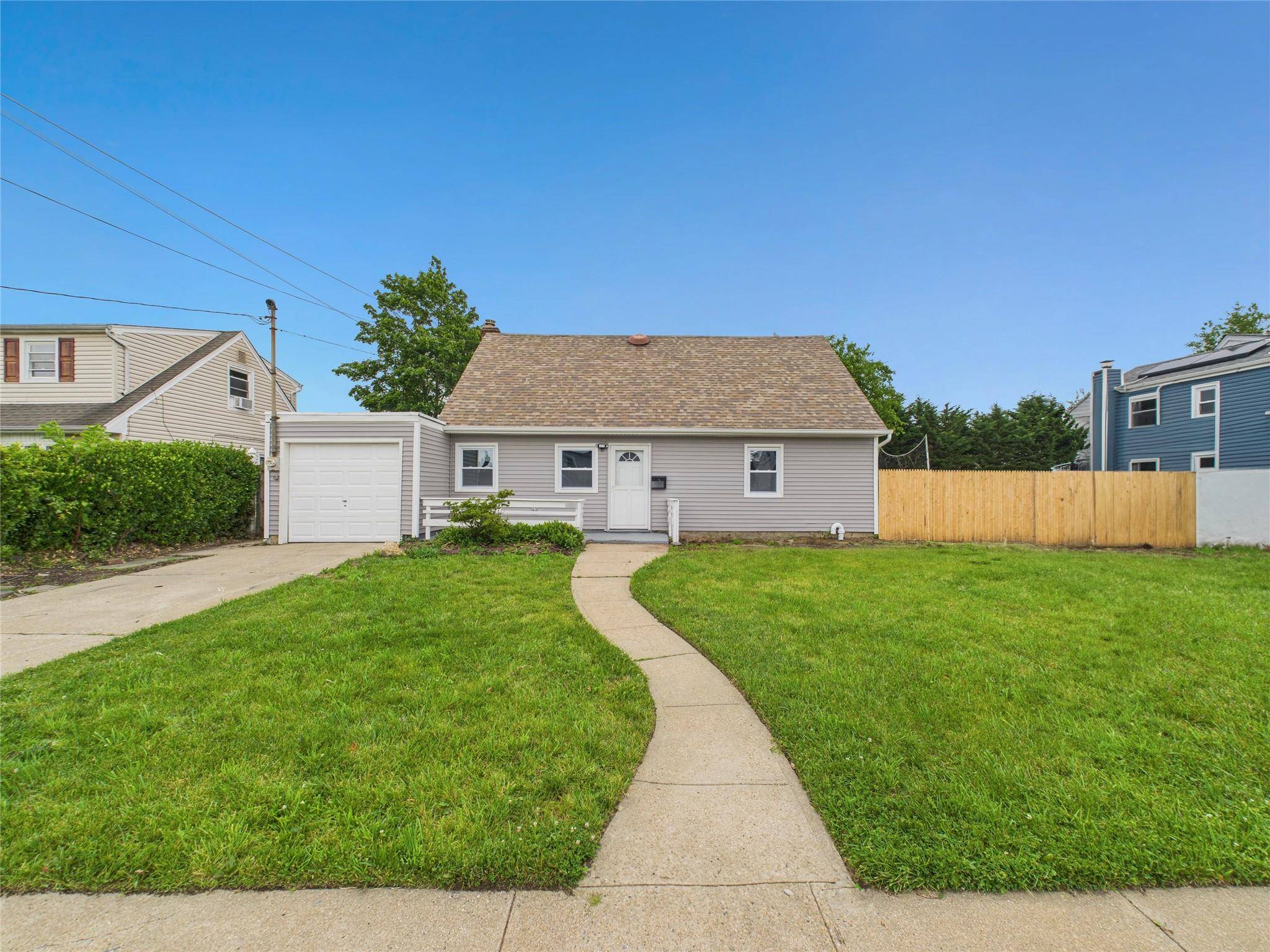 Beautifully renovated 5 bedroom, 2 bath Cape in the heart of Baldwin.