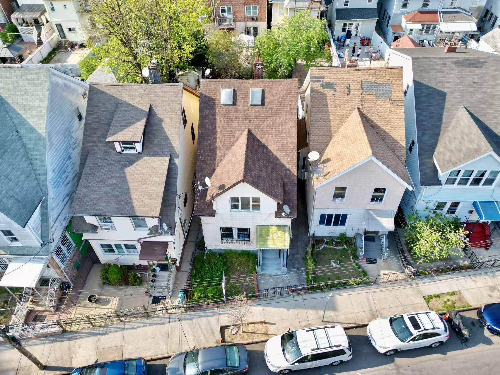 This is a high return two family house nestled in the heart of Elmhurst.