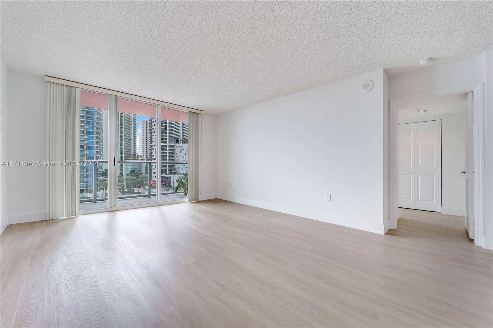 This remodeled 2 bed, 2 bath waterfront condo at The Mark on Brickell offers stunning bay and ocean views.