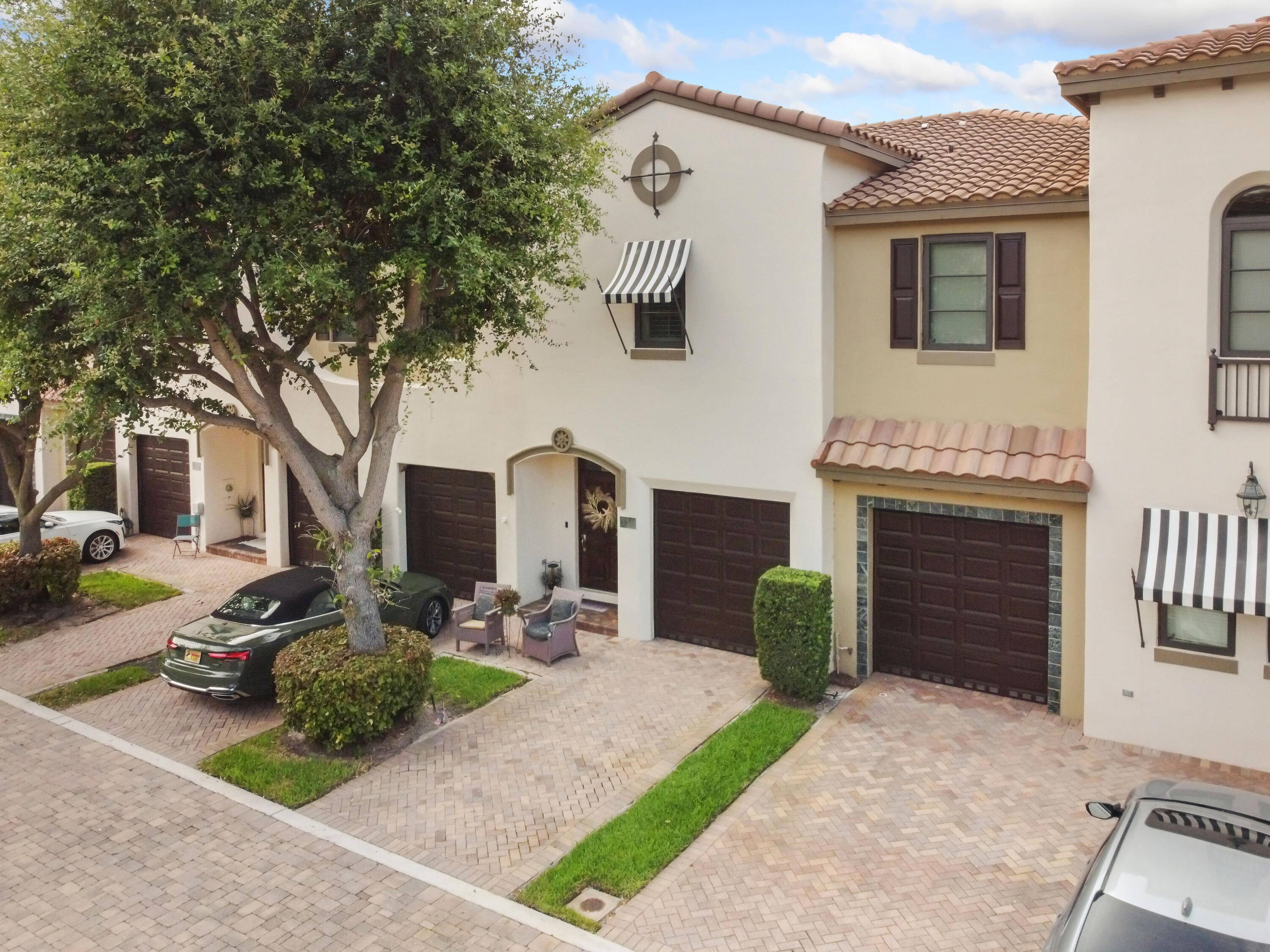 Discover coastal elegance in this exquisite townhouse featuring high ceilings and impact windows that flood the home with natural light.