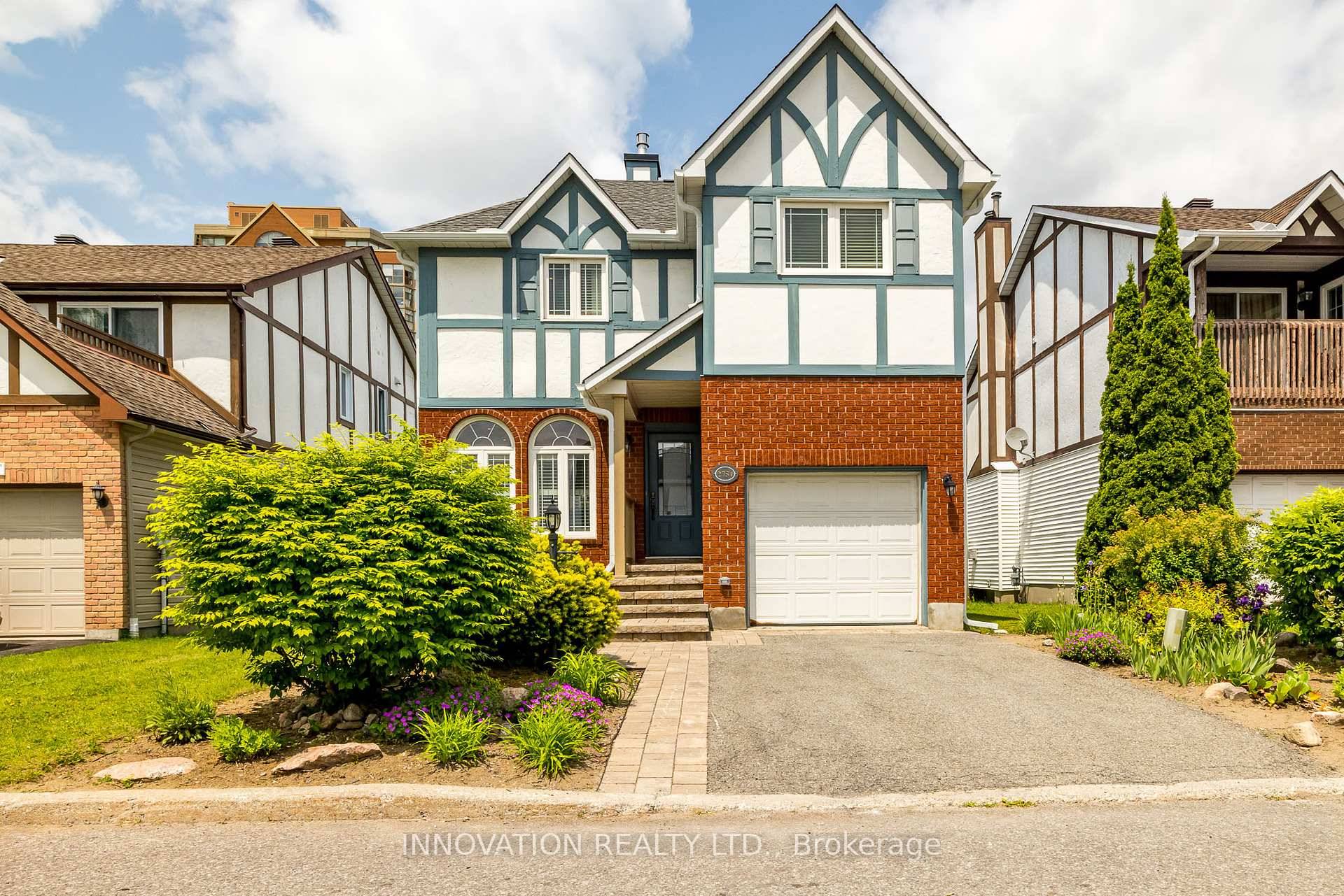 Welcome to this stunning Tudor style detached home, where timeless charm meets modern elegance.