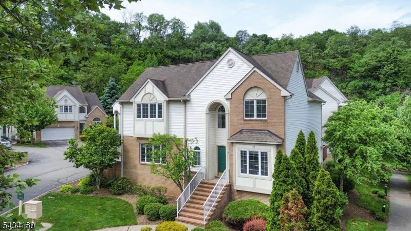 Experience refined luxury living in this exquisitely appointed free standing townhome within one of the area's prestigious gated communities.