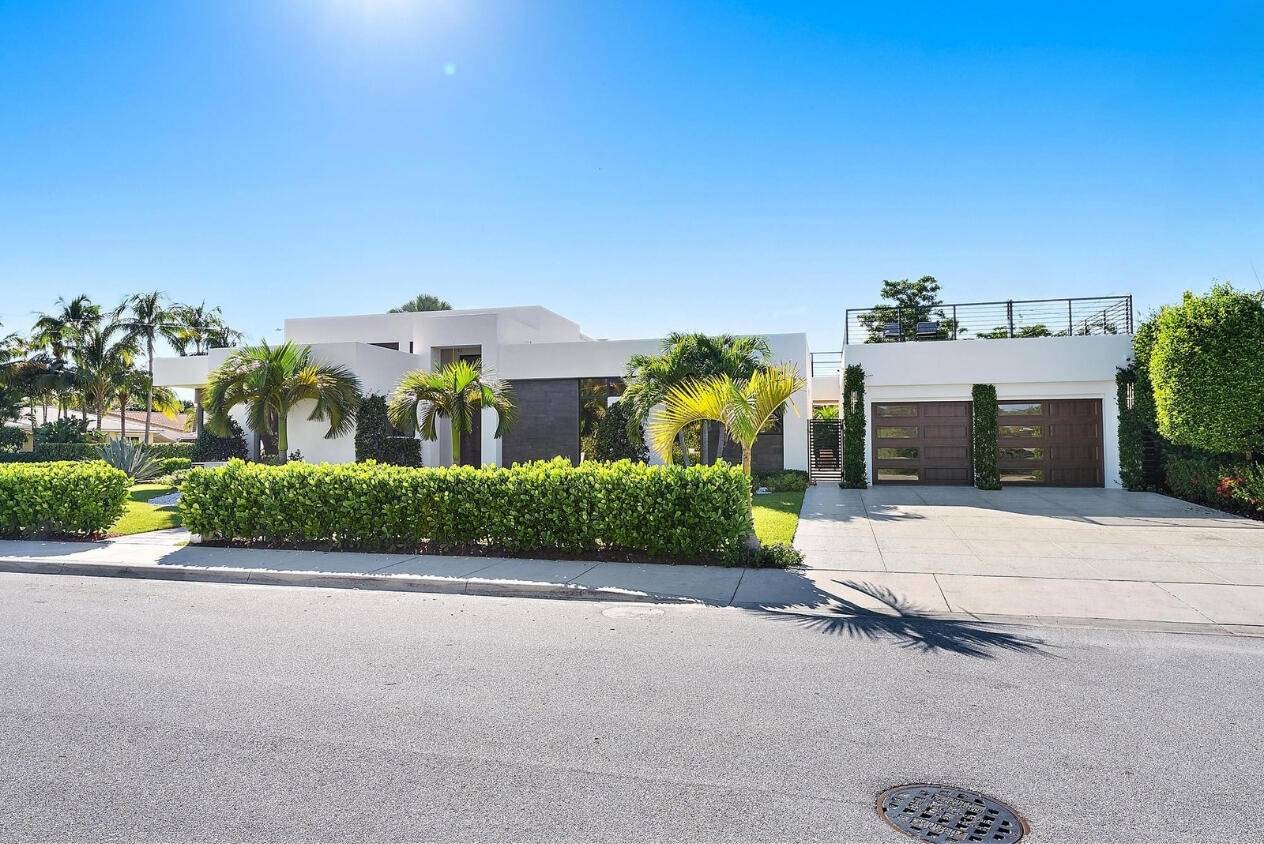 Welcome to a beautiful, newly built, modern home on one of Lake Worth Beach's most desirable streets located minutes from the ocean and downtown West Palm Beach.