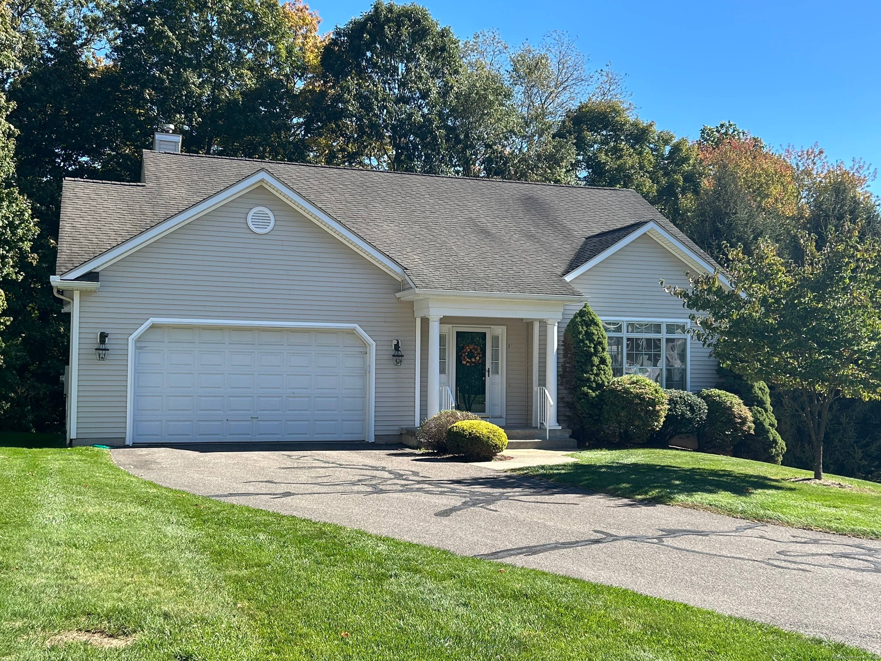 Beautiful pillars grace the tiled foyer of this natural light filled open floorplan ranch, with exquisite chandeliers, generous sized rooms, and vaulted ceiling in the sunroom.