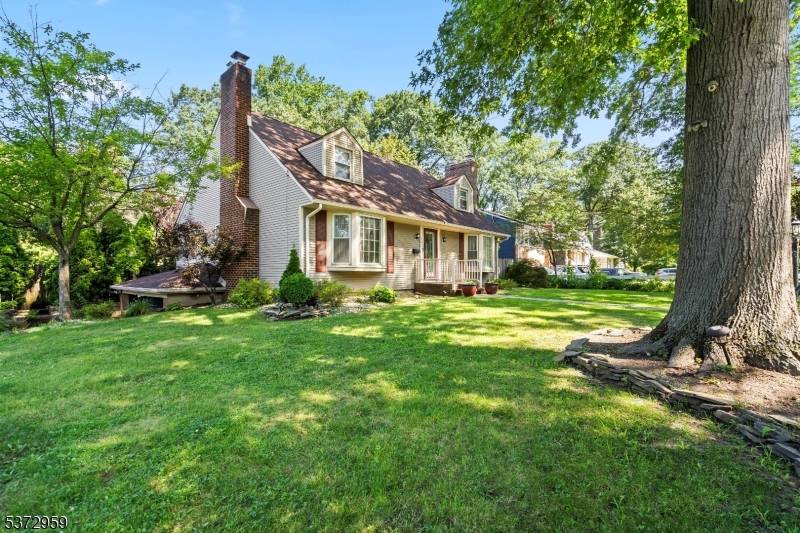 Welcome to 305 Mountain Avenue, a spacious Cape Cod style home on a corner lot in North Plainfield.