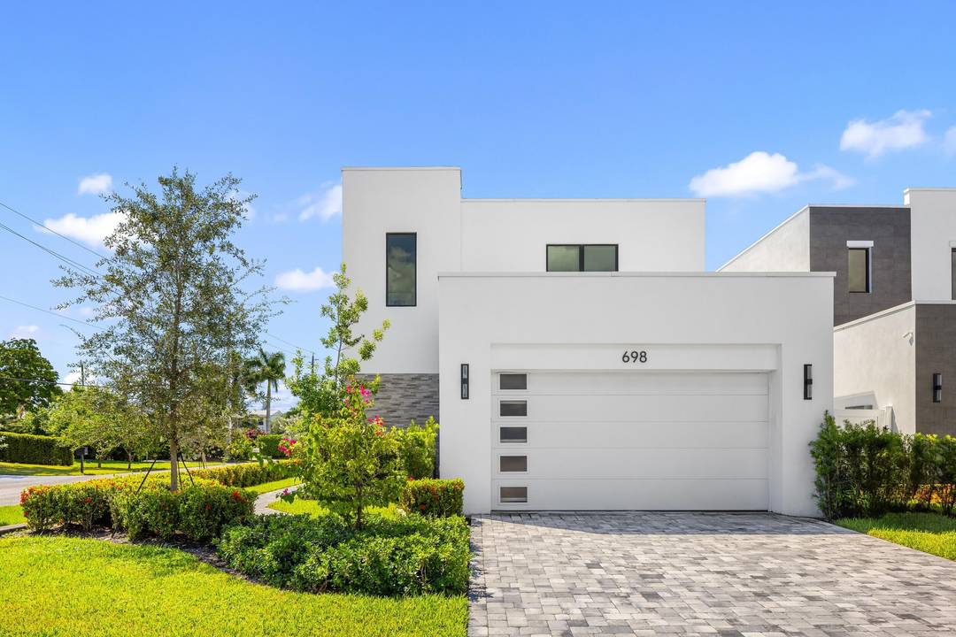 Presenting graceful architecture and light filled interiors, this East Boca Raton residence evokes the refined ease of contemporary living.