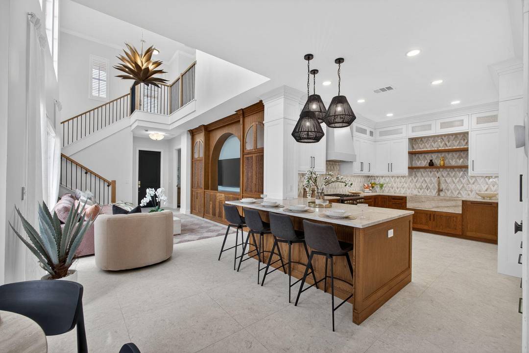 Interior designed, 3 bedroom courtyard home set on the coveted Stoney Green in gated community.