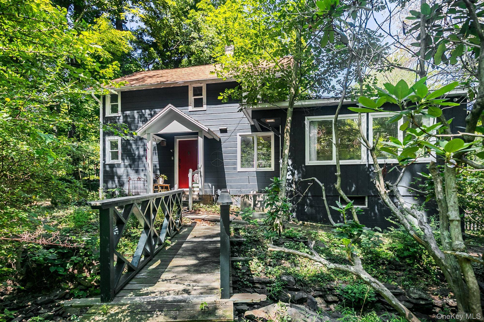 Welcome to The Mill House, nestled in the vibrant heart of Woodstock, NY a delightful farmhouse that beautifully blends historic charm with modern comforts.