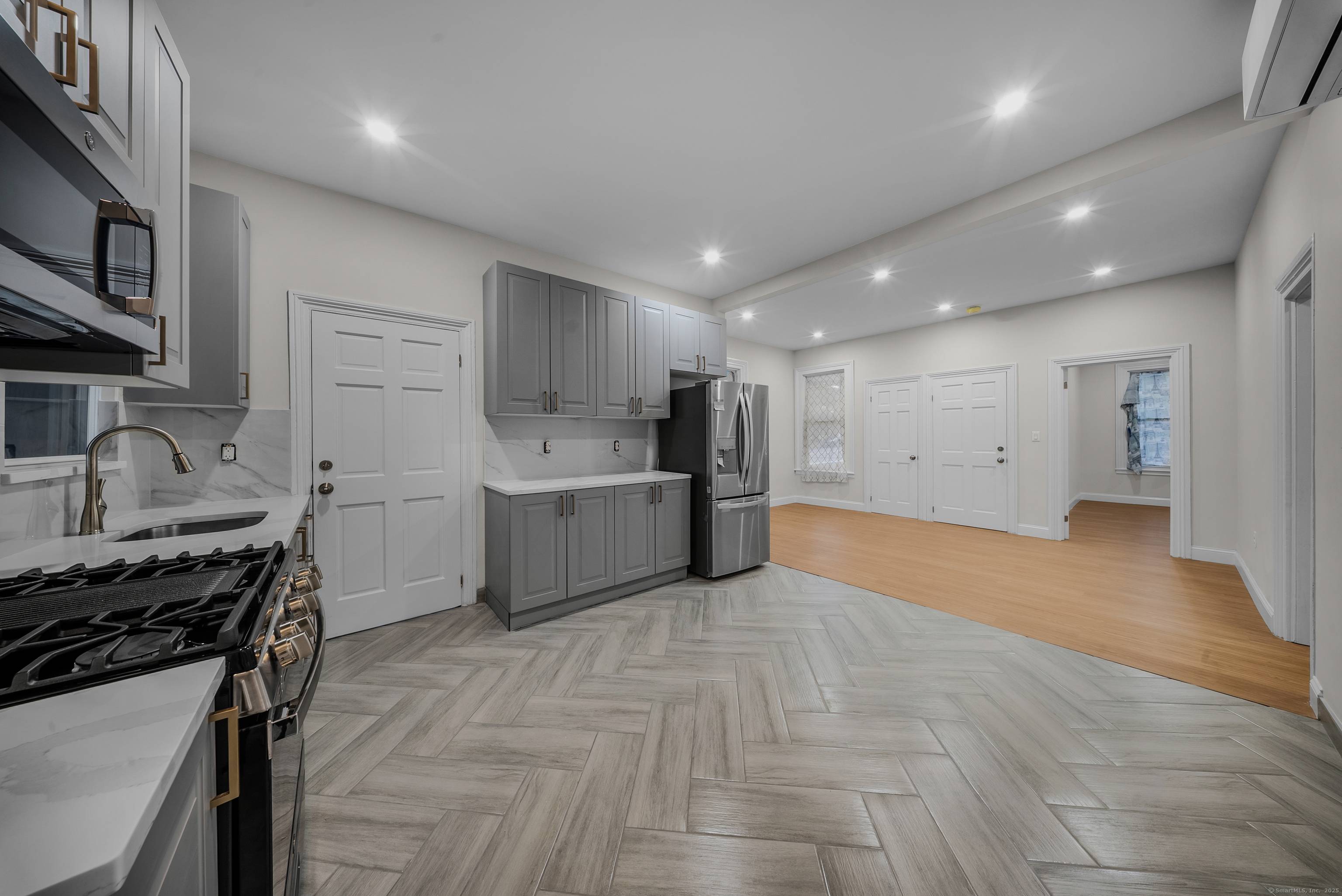 Recently updated 2 family house situated on a leveled corner lot featuring laundry hook ups in each unit, beautiful hardwood floors, and split units for efficient heating and cooling.
