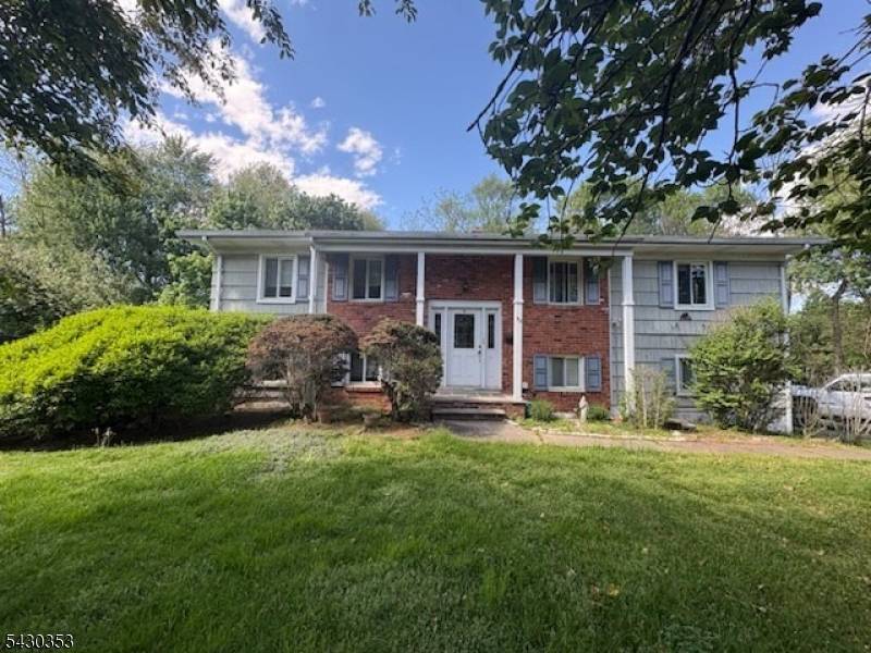 92 Fairway Drive presents a rare opportunity to renovate and customize a spacious bilevel home in desirable East Hanover.