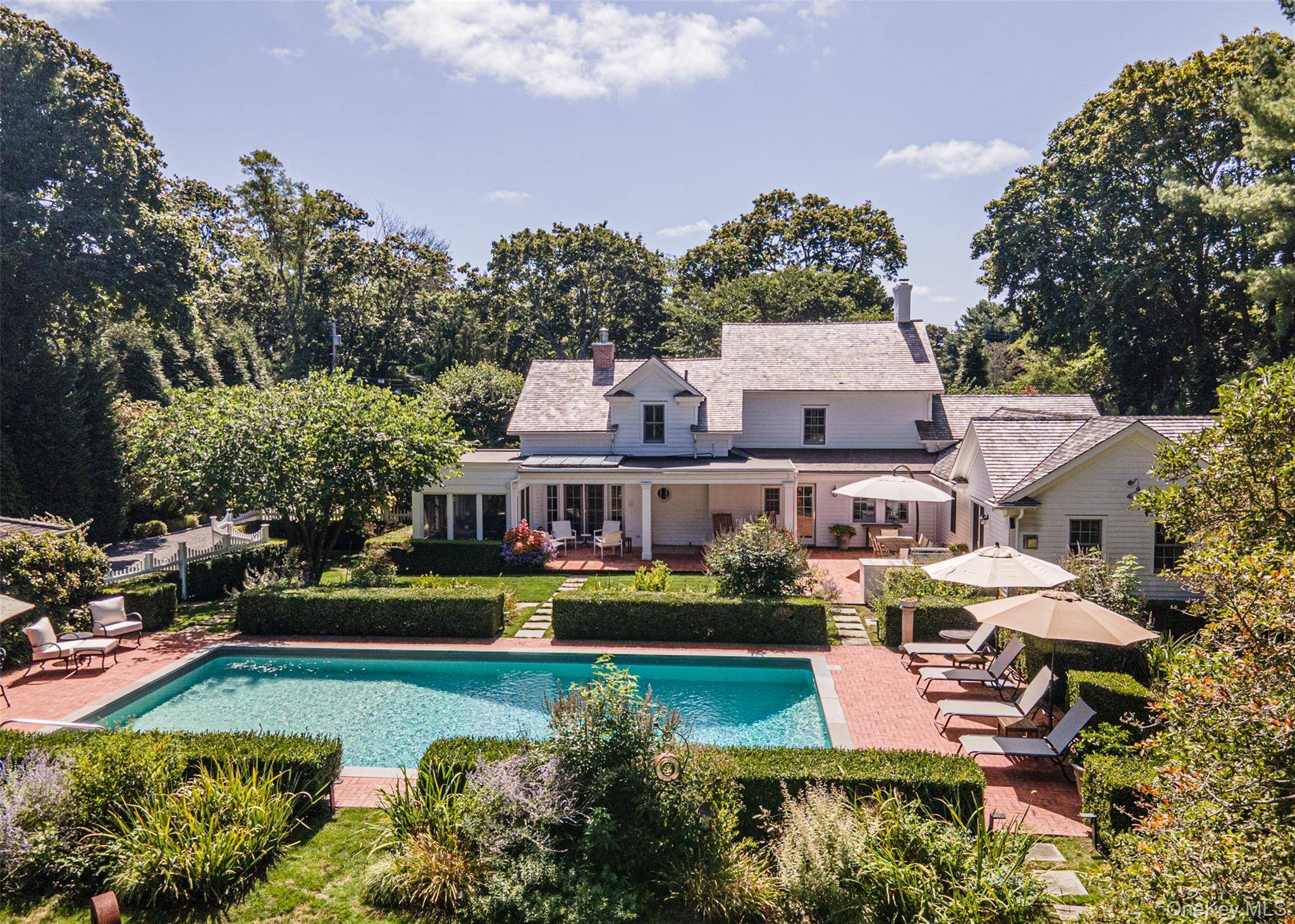 Welcome to 92 South Country Road, a remarkable residence where 18th century charm meets contemporary luxury in the serene hamlet of Remsenburg.