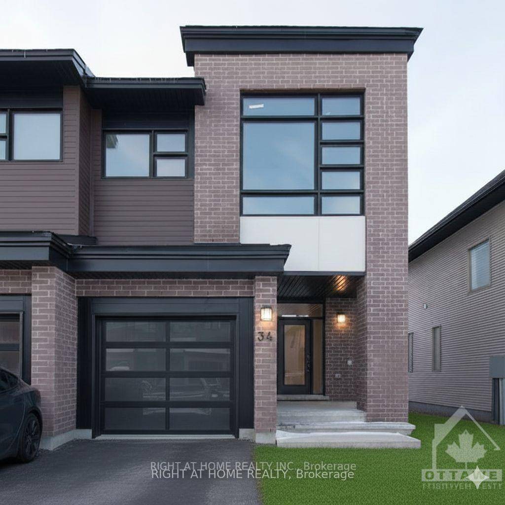 This beautifully maintained Urbandale Discovery model townhome features hardwood flooring throughout the open concept living and dining areas, with upgraded tile in the entryway and kitchen.