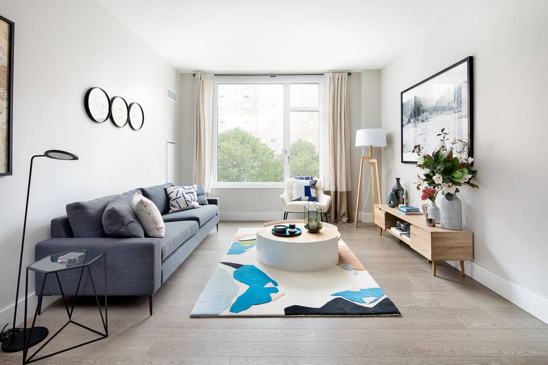 Residence 517 features oversized windows, a dressing area, and an in unit Bosch washer dryer.