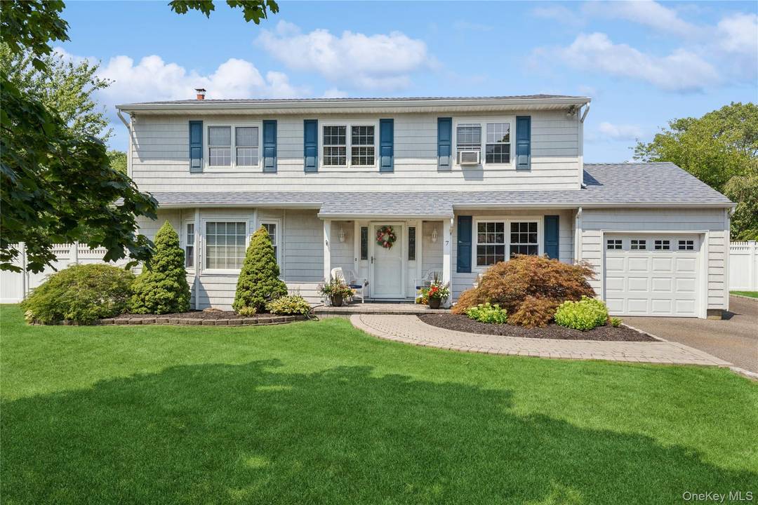 Welcome to 7 Mark Lane, a beautifully maintained Colonial in the heart of Farmingville.