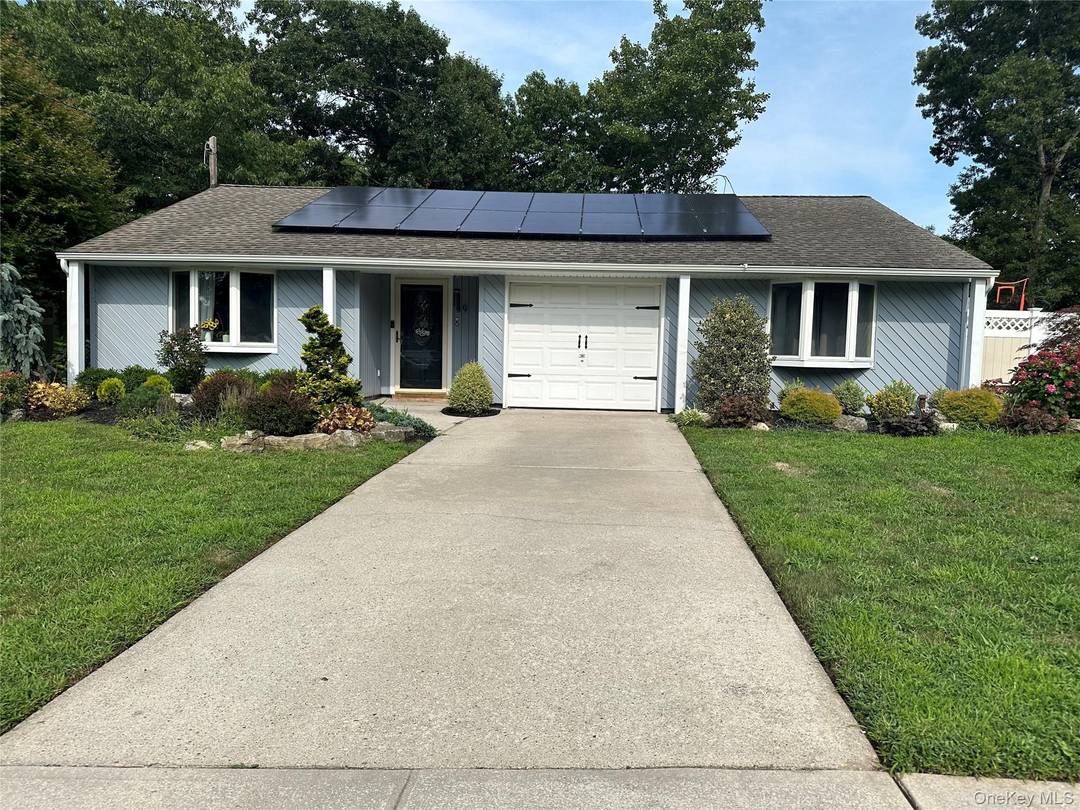 Welcome to One Level Living surrounded by a beautifully landscaped property.