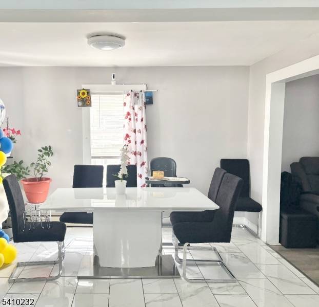 A charming front porch invites you into this beautiful home.